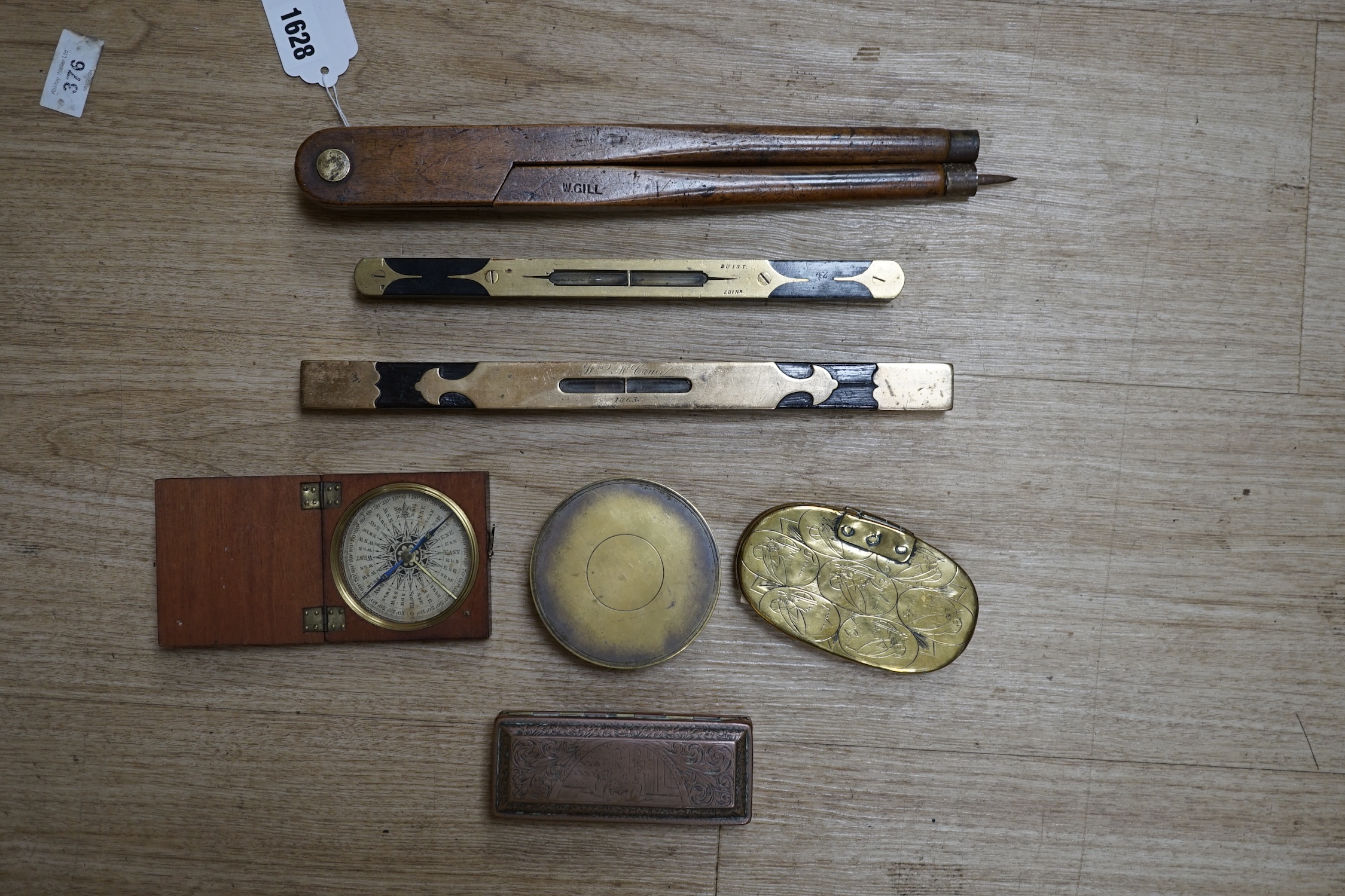 Two portable sundials, two brass inlaid spirit levels and a wood compass, wooden compass 34cm long. Condition - fair to good